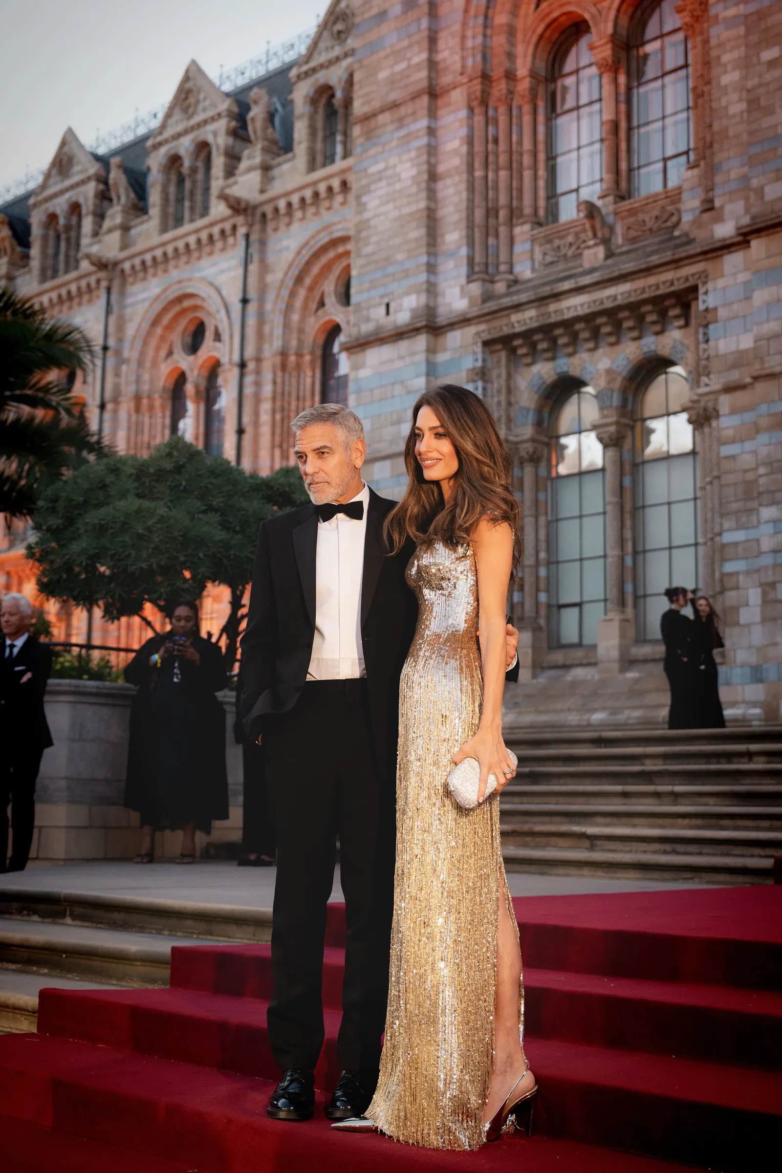 Image may contain George Clooney Amal Clooney Adult Person Fashion Photobombing Wedding Body Part and Hand