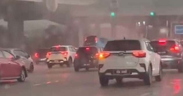 Car lifted by strong winds at a toll plaza in Damansara, from a video by @zhaeim on Threads