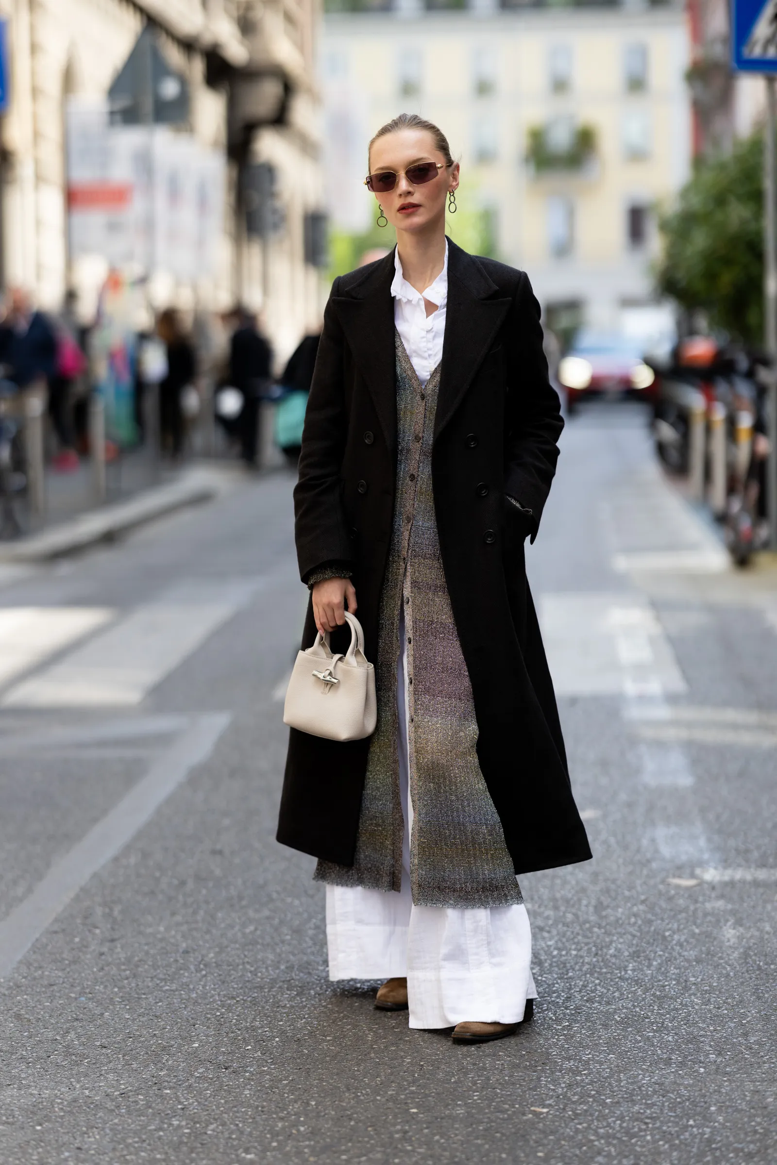 Image may contain Clothing Coat Overcoat Blazer Jacket Accessories Bag Handbag and Person