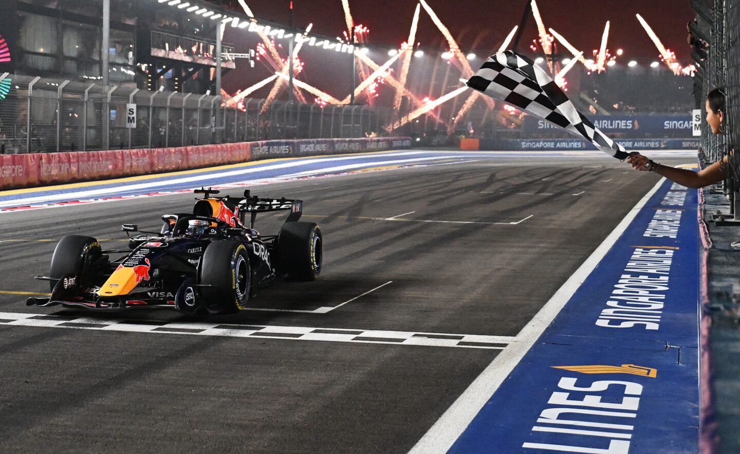SINGAPORE, SINGAPORE - OCTOBER 11: Race winner Max Verstappen of the Netherlands driving the (3) Oracle Red Bull Racing RB22 Red Bull Ford Powertrains takes the chequered flag during the F1 Grand Prix of Singapore at Marina Bay Street Circuit on October 11, 2026 in Singapore, Singapore. (Photo by Mark Sutton - Formula 1/Formula 1 via Getty Images)