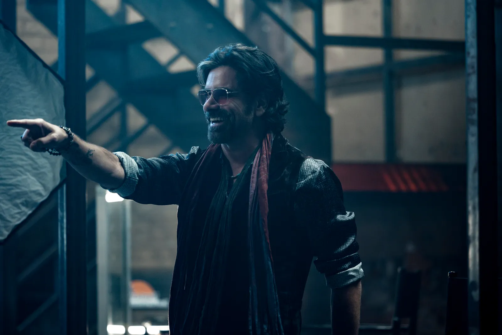 Image may contain John Stamos Face Head Person Happy Smile Adult Photography Portrait Hair and Performer