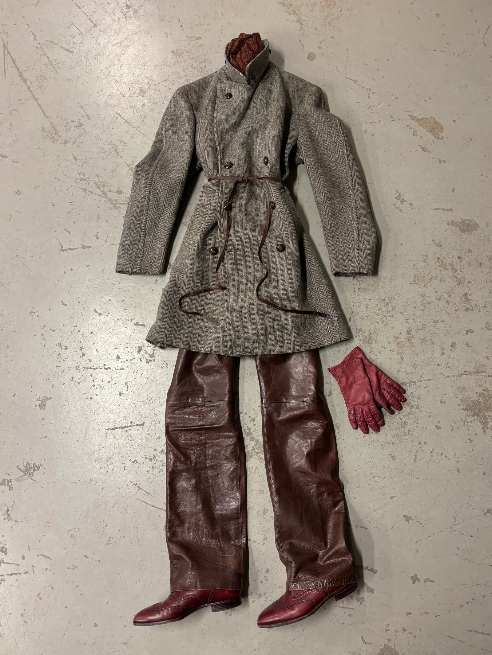 Image may contain Clothing Coat Overcoat Adult Person Toy and Glove