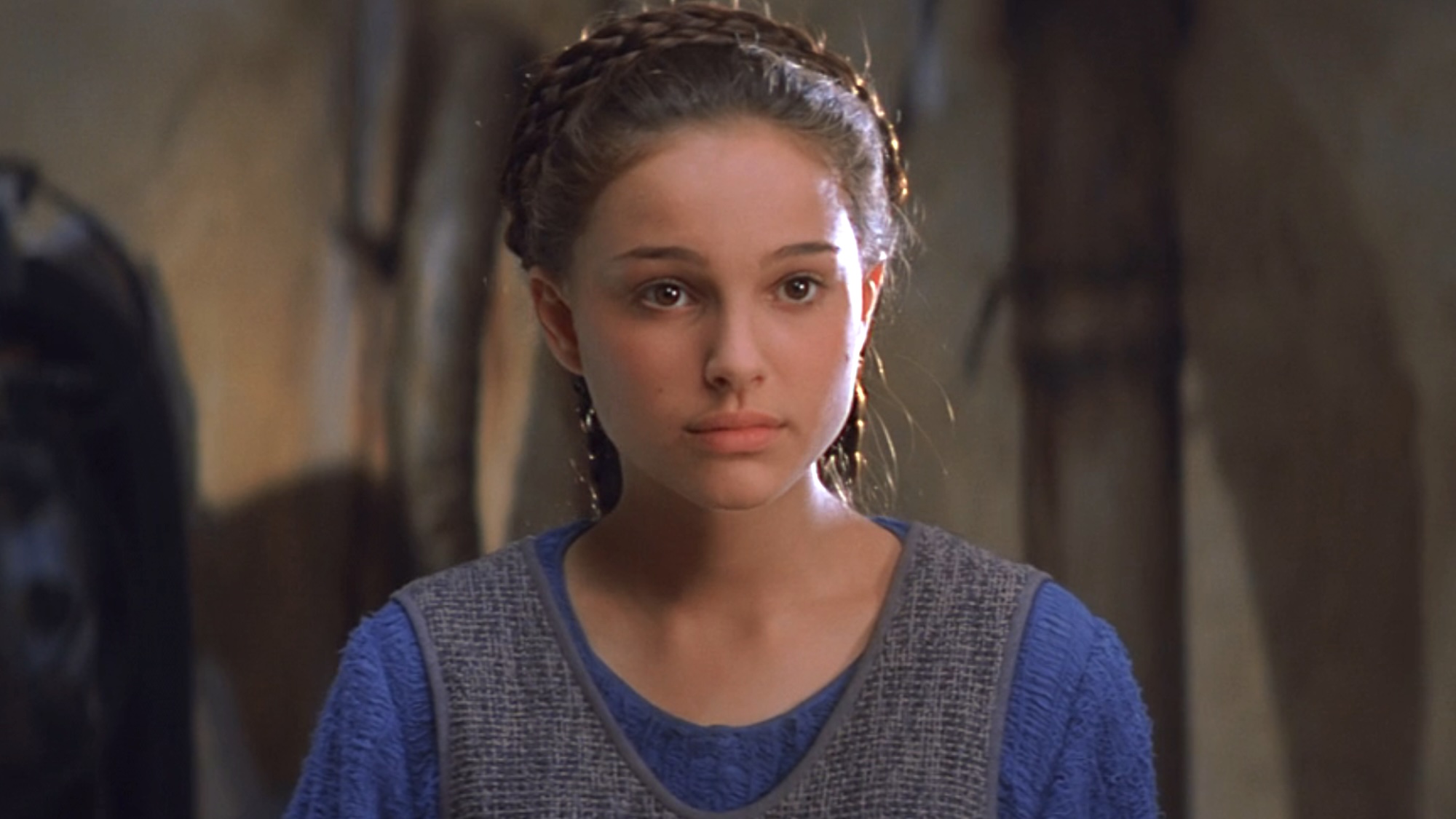 Padme wearing her blue outfit on Tatooine talking to Anakin in The Phantom Menace.
