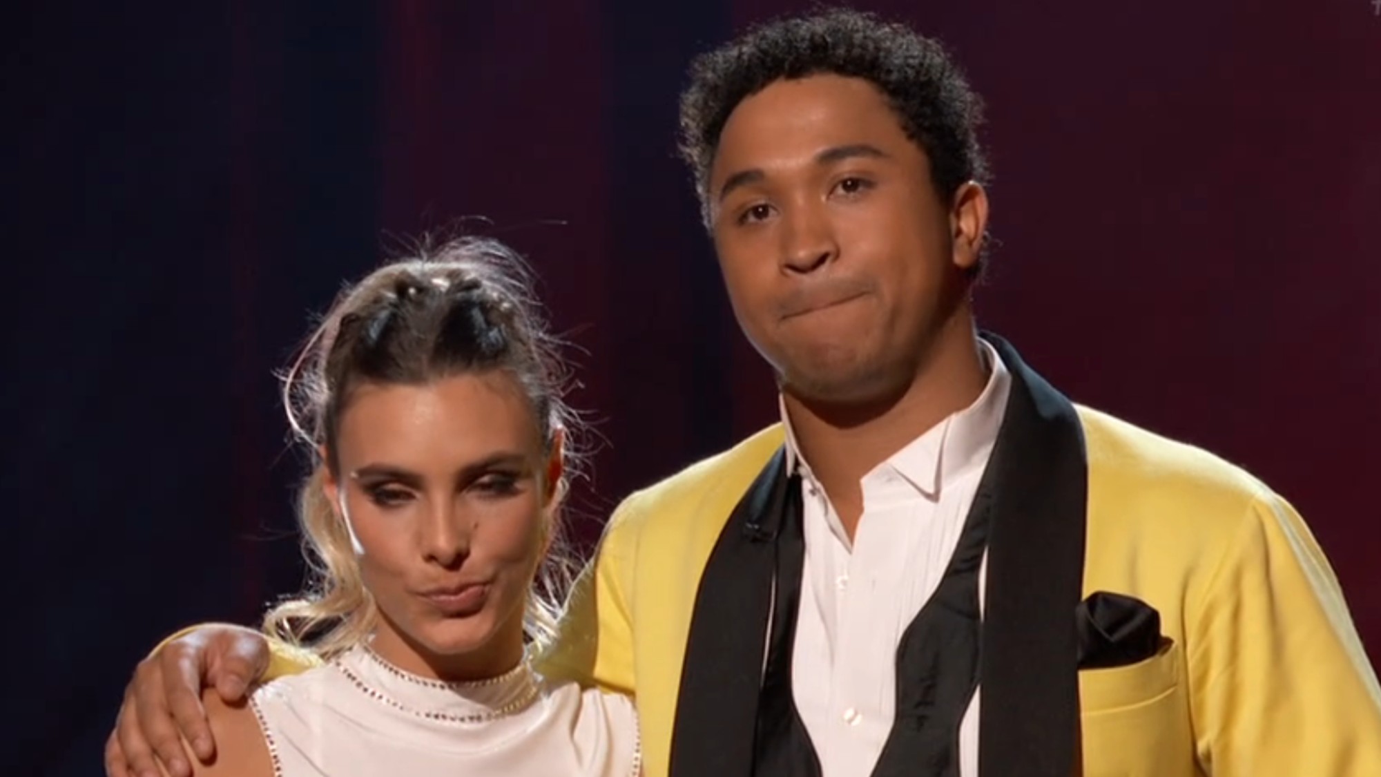 Lele Pons wearing white and Brandon Armstrong wearing a yellow blazer.