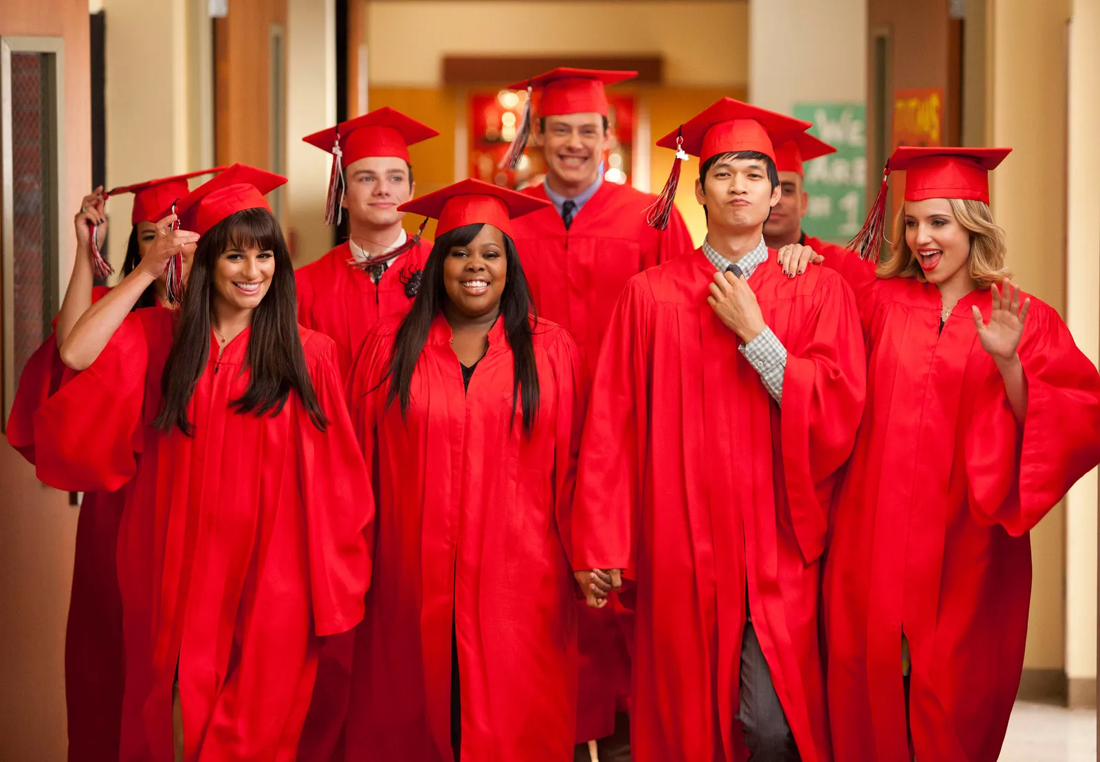 Image may contain Amber Riley Harry Shum Chris Colfer Cory Monteith People Person Graduation Adult Student and Face