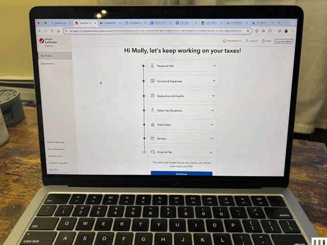 Closeup of an open laptop with the screen showing Turbo Tax tax filing software
