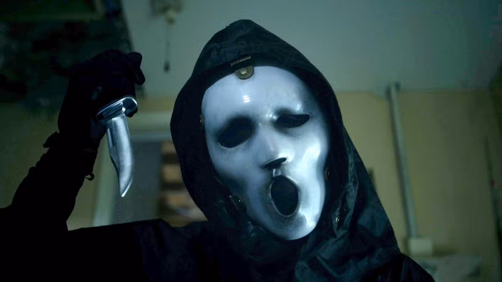 A masked killer holds up a knife in Scream: The TV Series