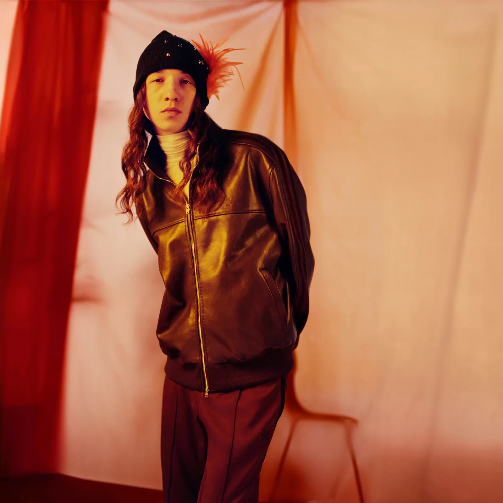 Image may contain Clothing Coat Jacket Adult Person Fashion Photography Performer Solo Performance Face and Head