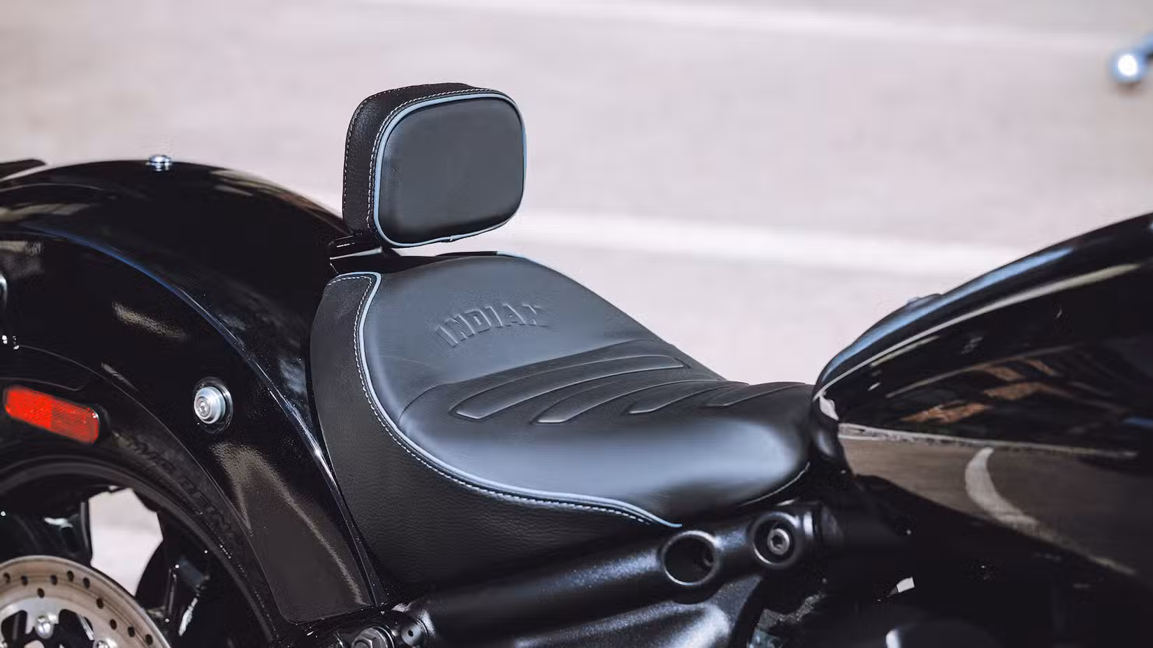 Accessorized 2025 Indian Scout Sixty Bobber saddle close-up detail
