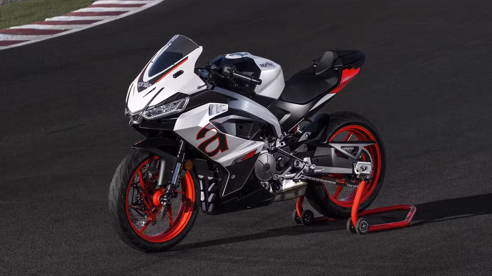 Aprilia RS 457 Opalescent White parked on a race track