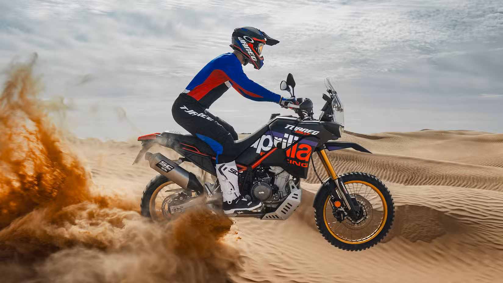 Action shot of the Aprilia Tuareg Rally 660 riding through the desert