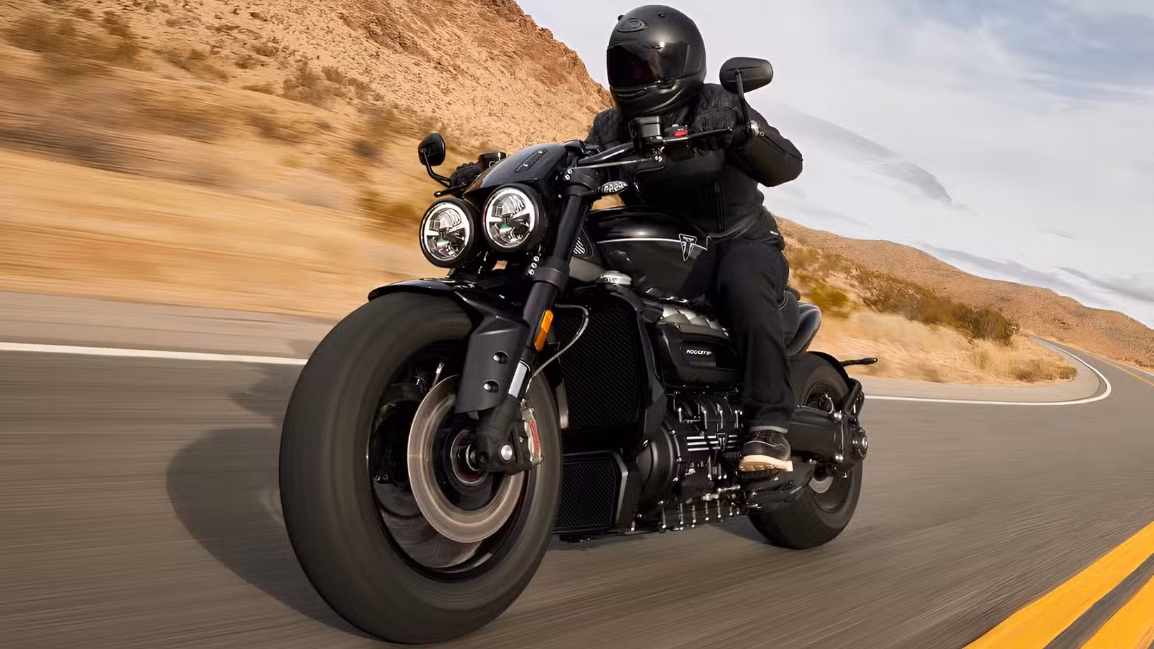 2025 Triumph Rocket 3 Storm GT accelerating front third quarter view