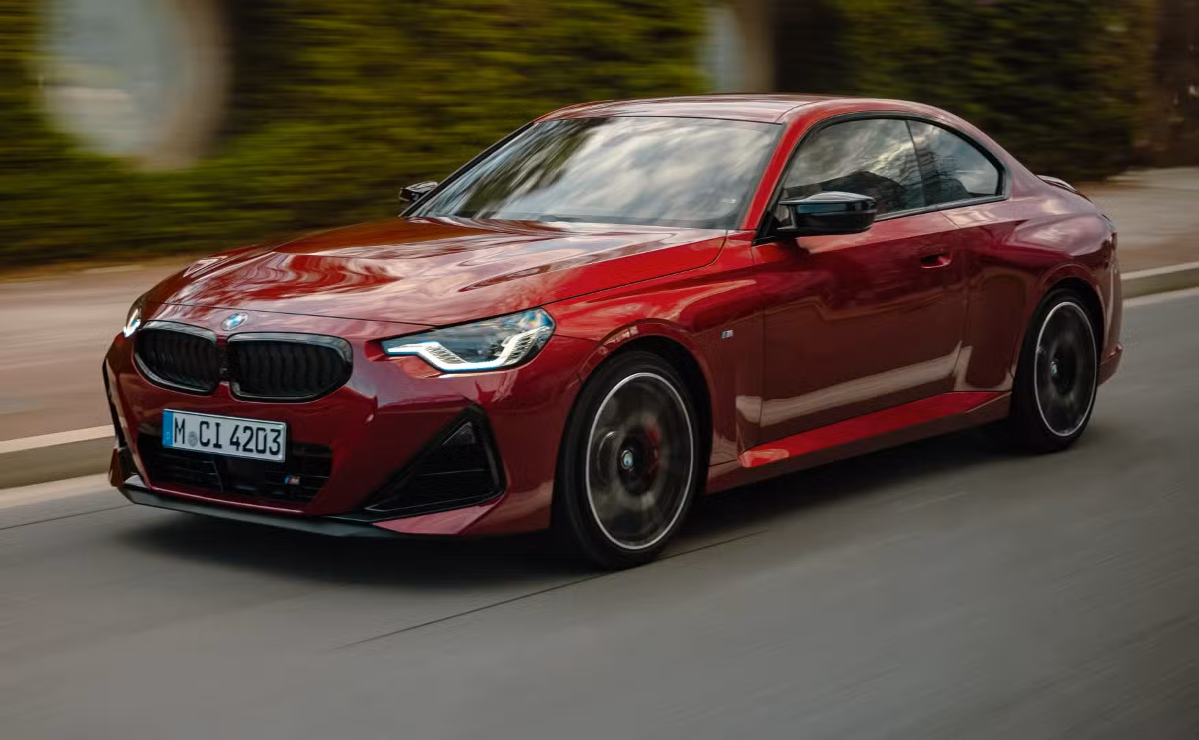 BMW M240i xDrive front-quarter tracking