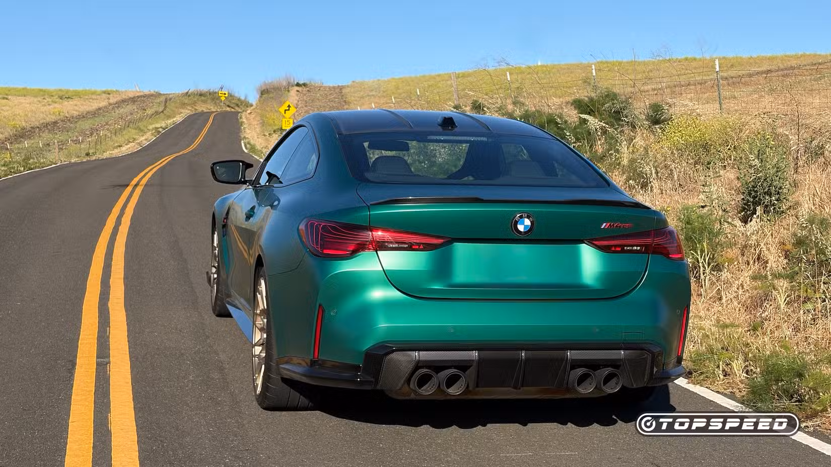 BMW M4 CS exterior rear view on the road