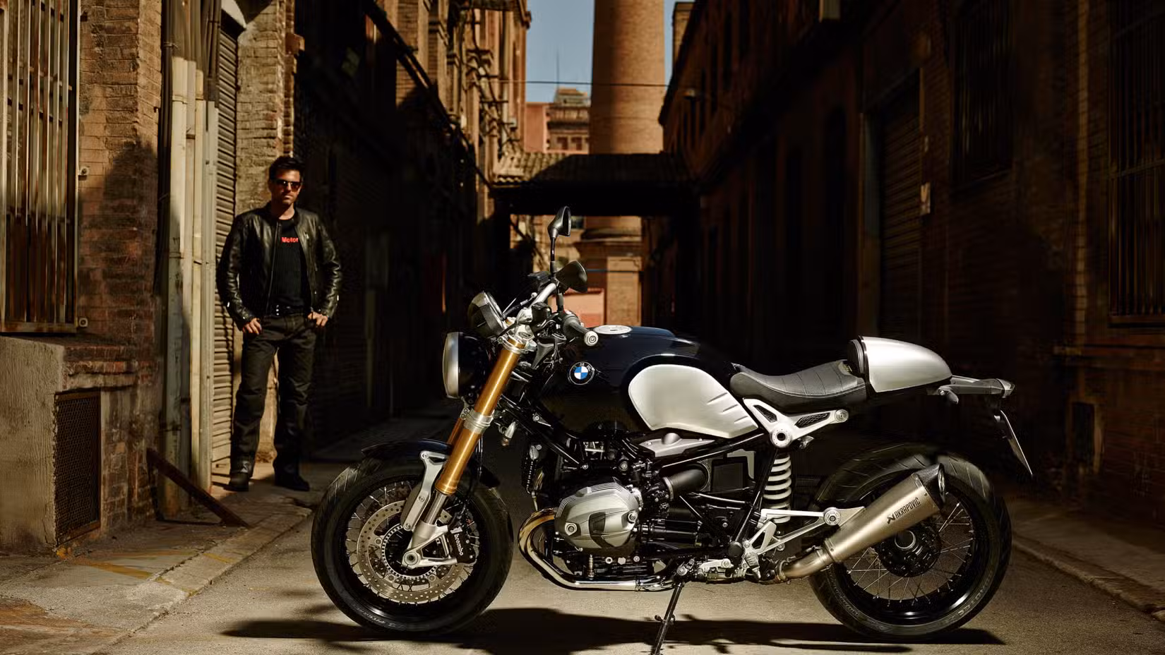 Static hero shot of 2014 BMW R nineT with the rider overlooking