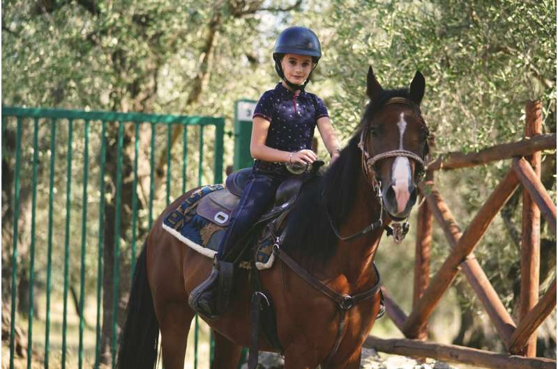 child riding a horse
