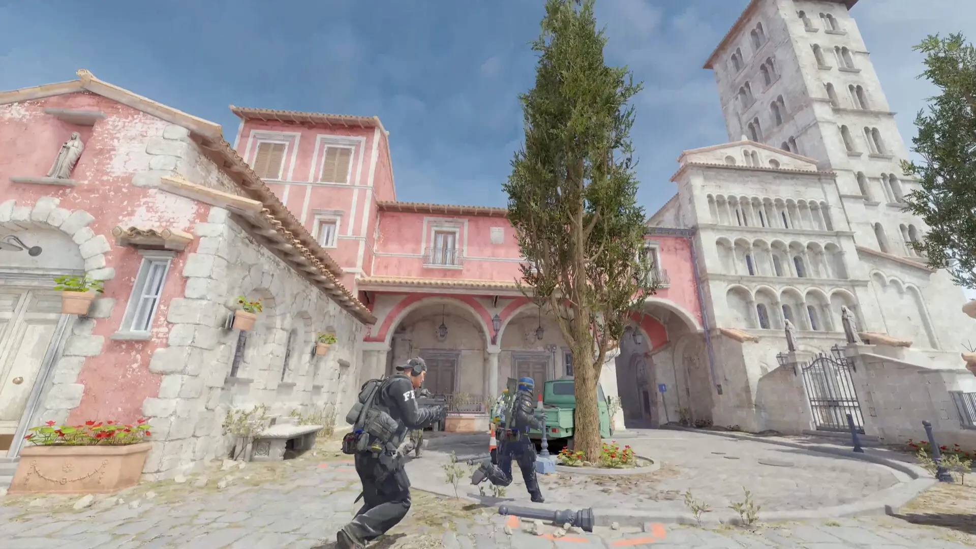 Counter-Terrorist operatives moving through a Mediterranean town square in Counter-Strike 2.