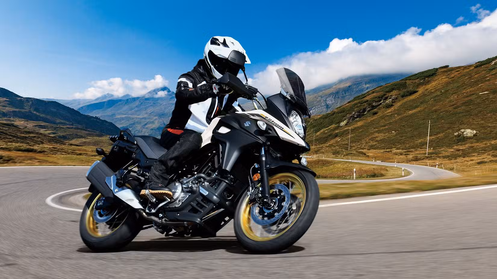 A photo of the Suzuki V-Strom 650XT cornering on country roads