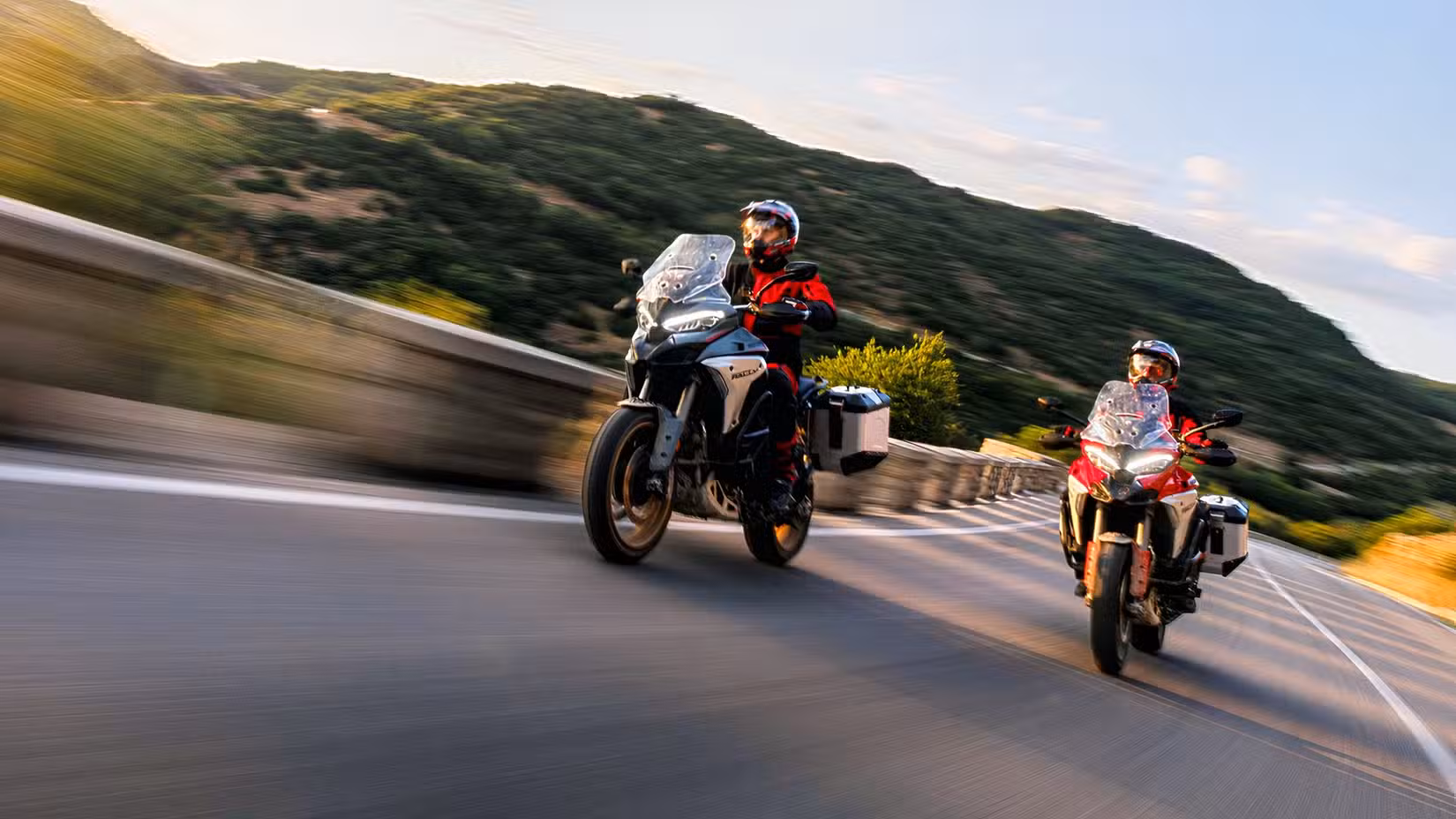 Action shot of two Ducati Multistrada V4 Rally adventure bikes riding together