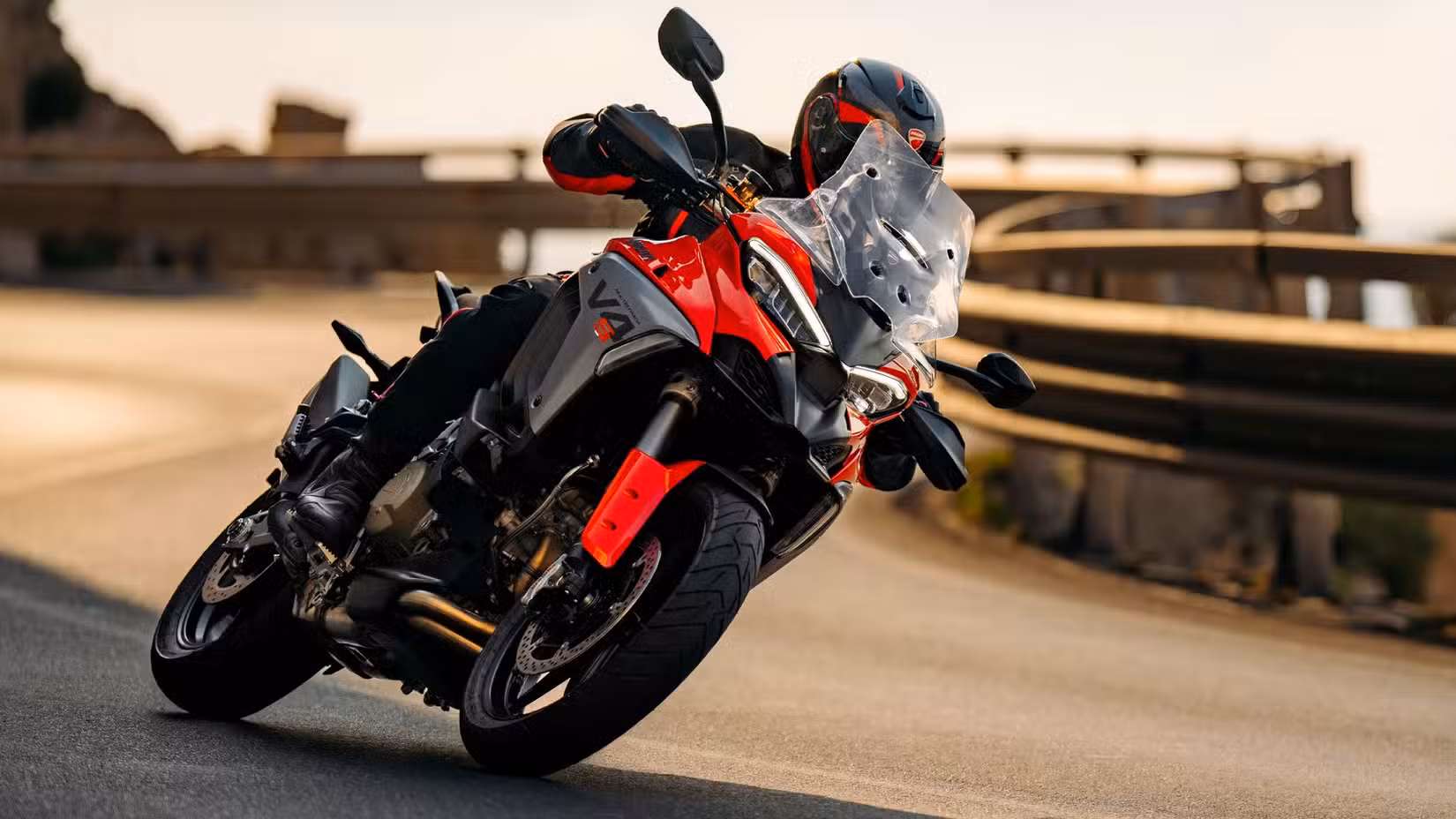 A rider cornering hard aboard the Ducati Multistrada V4 S 