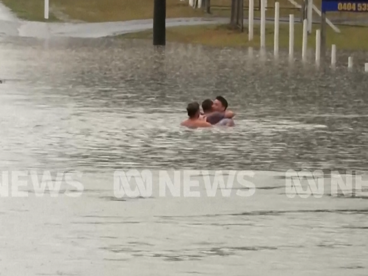 102226 australia flood SUB hugging