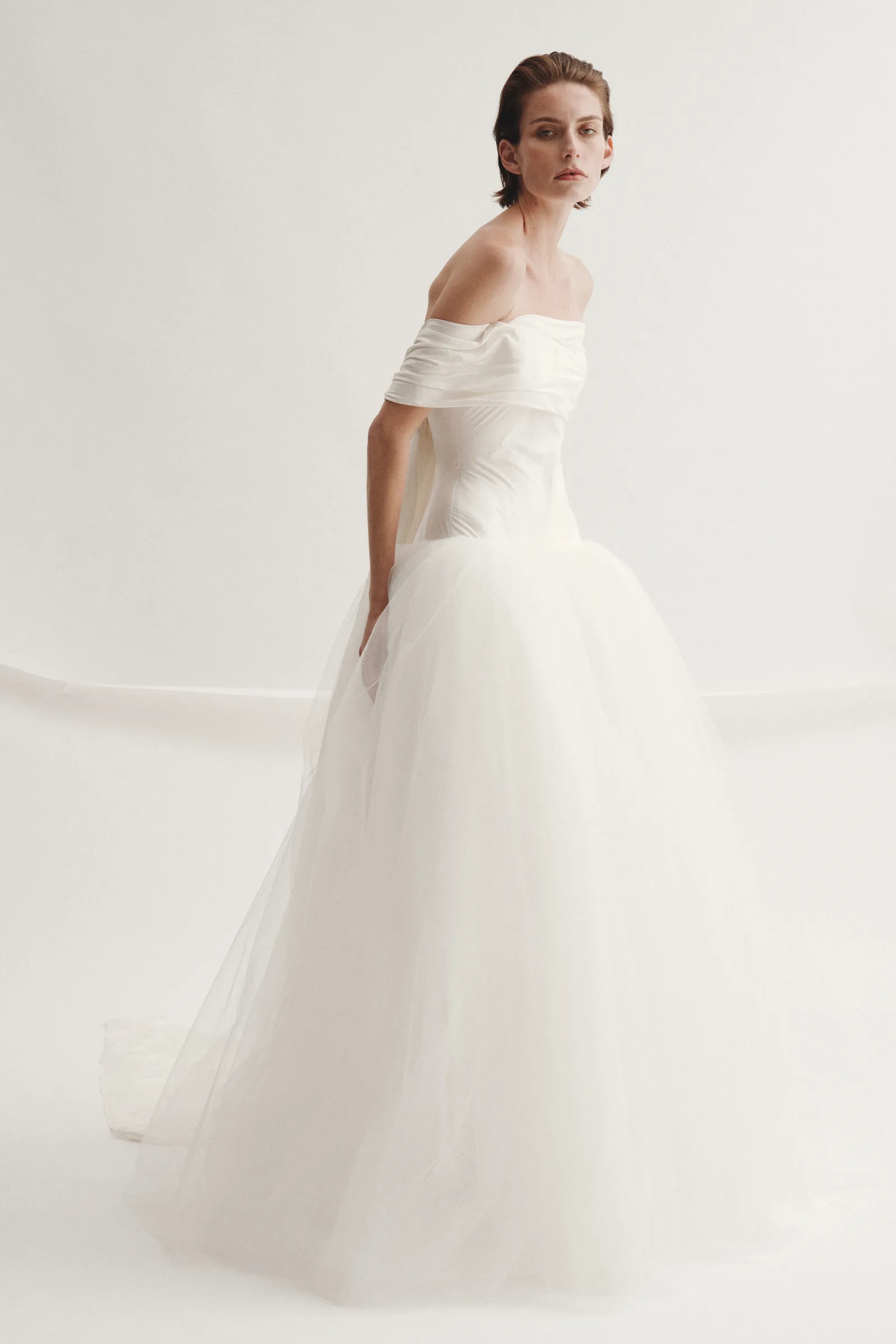 Image may contain Clothing Dress Fashion Formal Wear Gown Wedding and Wedding Gown