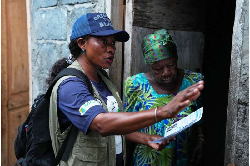 A worker educates a resident ahead of the spraying exercise to help prevent the spread of malaria in Malabo, Equatorial Guinea, April 24, 2026. Credit: AP Photo/Misper Apawu Equatorial Guinea Malaria