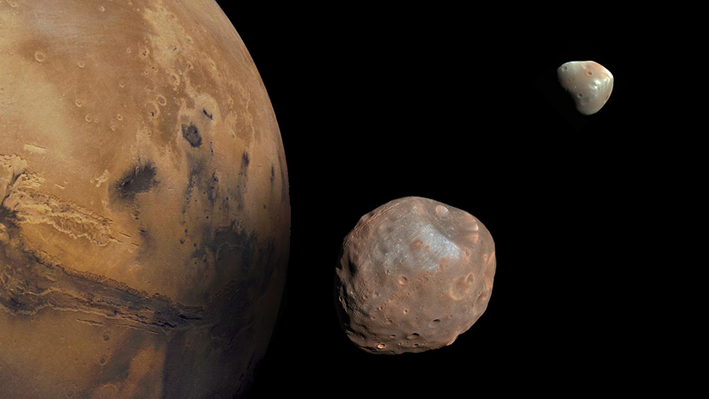 A composite image showing Phobos and Deimos next to Mars