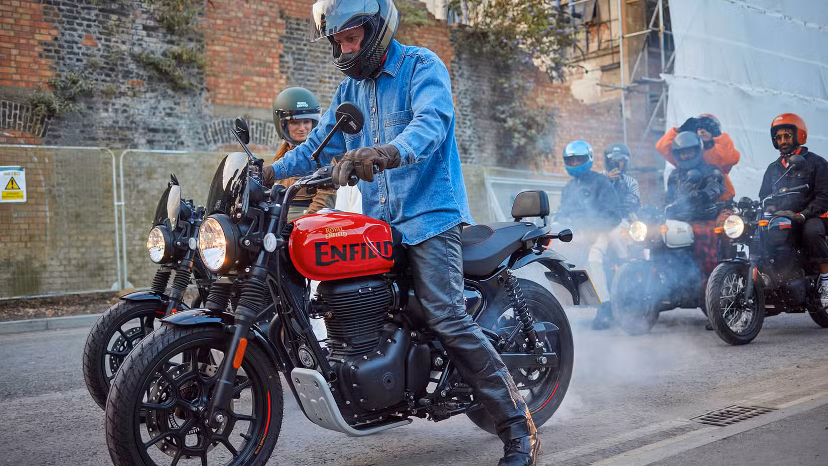 Red 2023 Royal Enfield Hunter 350 doing a burnout