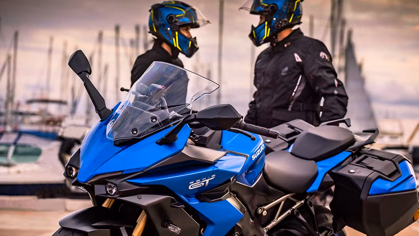 Suzuki GSX-S1000GT+ close-up shot with rider in the background