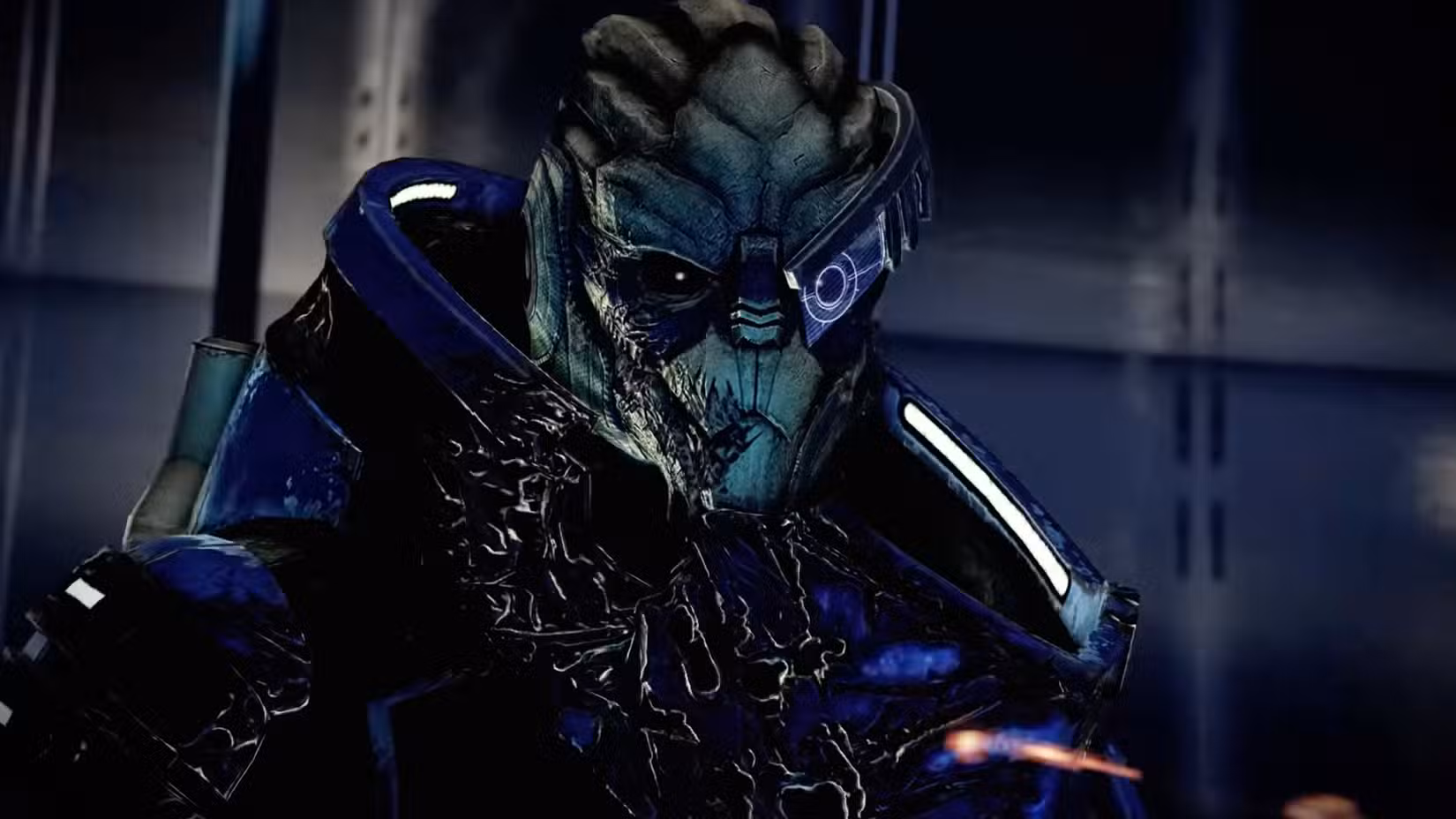 A close-up of Garrus, an alien from Mass Effect, wearing blue armor and a visor over one eye.