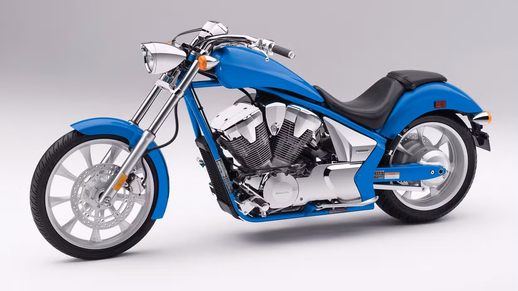 Studio shot of a blue Honda Fury, front left three quarter