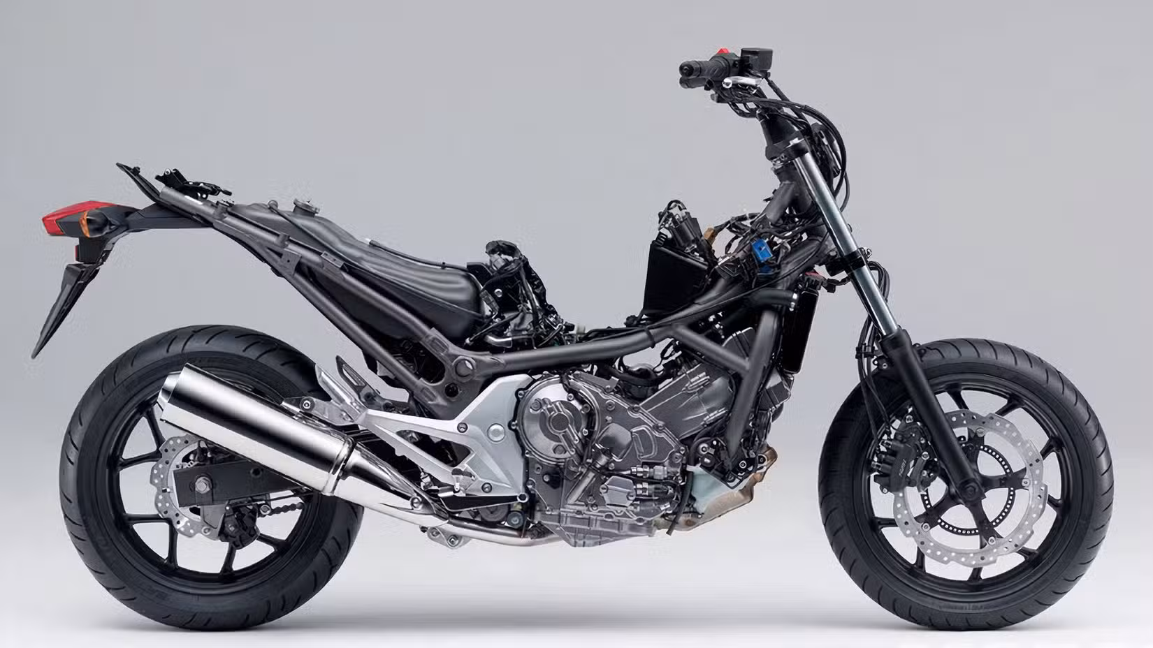 Honda NC750X bare chassis that shows the under-seat fuel tank, freeing up the storage space