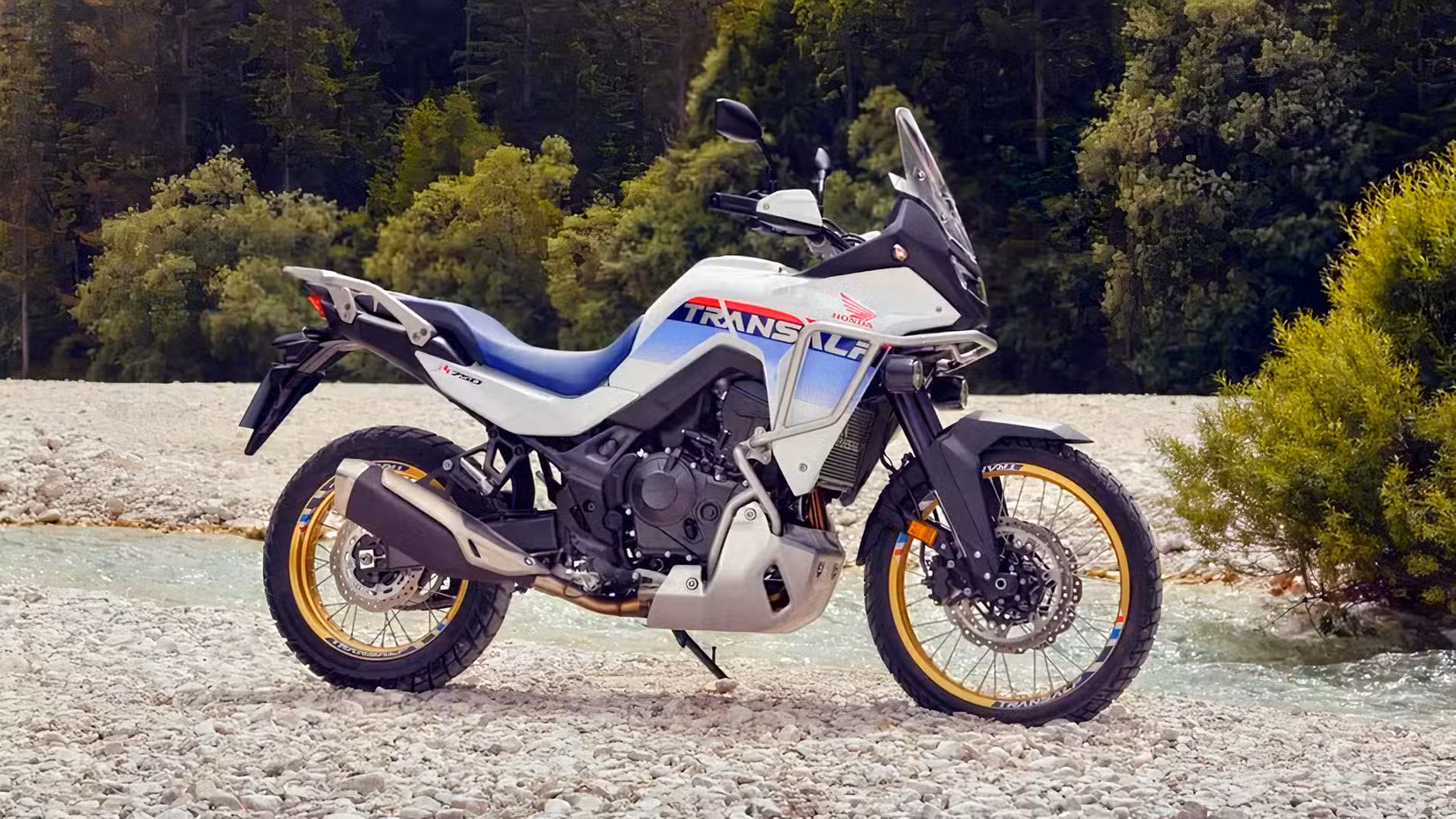 Honda XL750 Transalp parked off-road near a stream