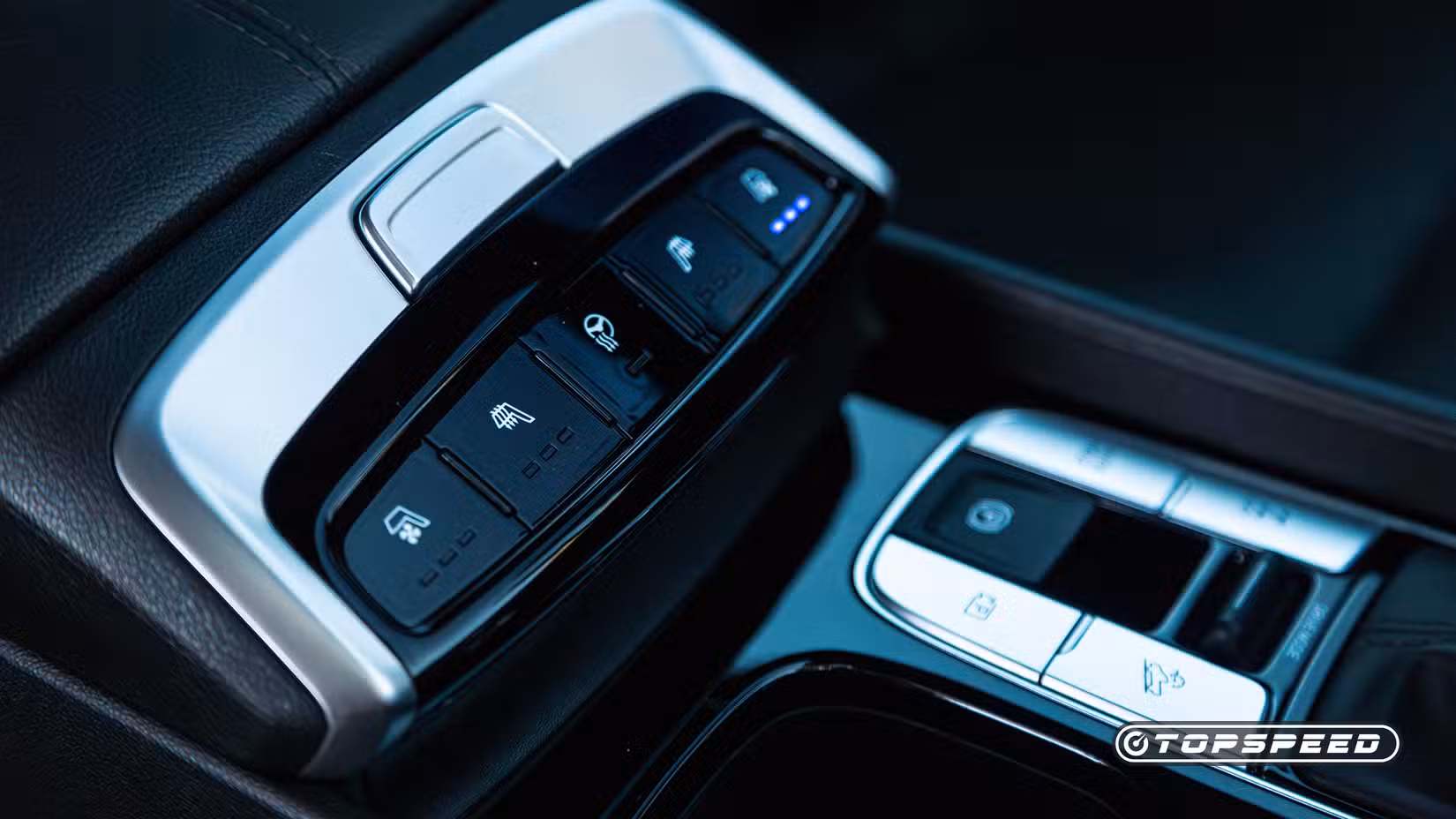 View of the heated-and-ventilated seat controls, and heated steering wheel control, of the 2024 Hyundai Santa Cruz Limited