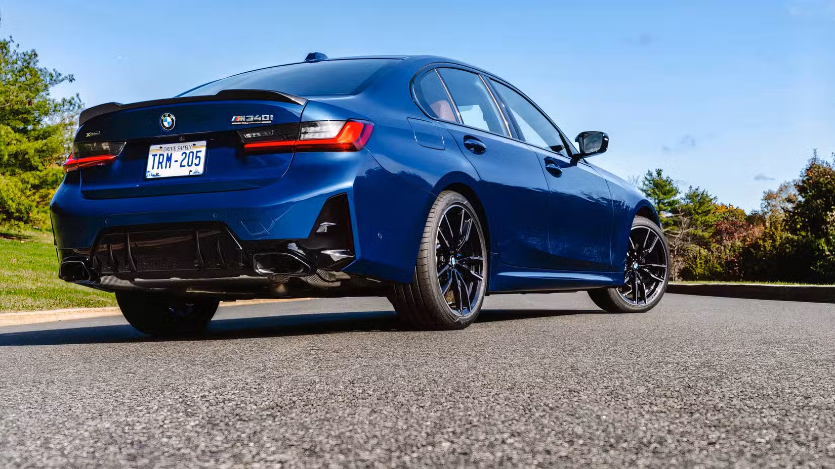 Rear 3/4 shot of 2026 BMW M340i parked