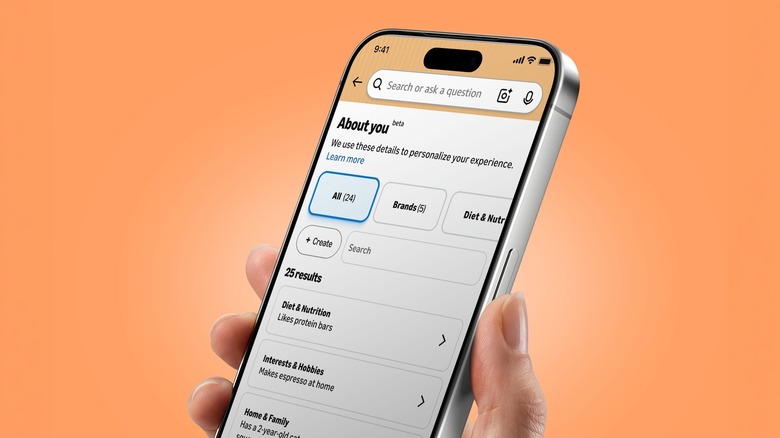 Closeup of a phone in hand, showing their Amazon Shopping About You page
