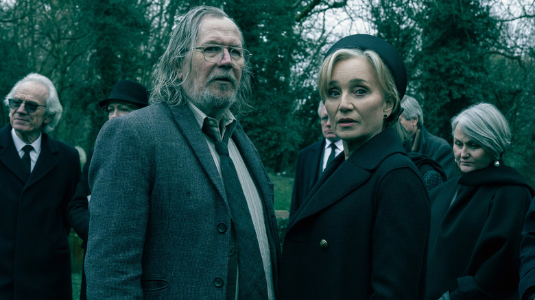 Lamb and Taverner stand next to each other at a funeral in Slow Horses Season 6