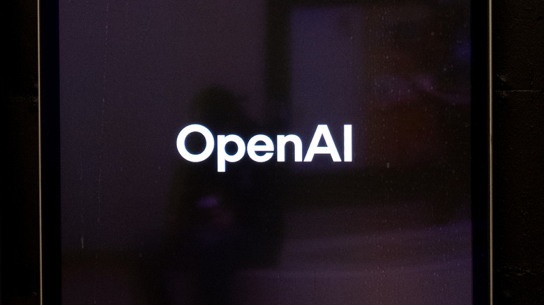 The OpenAI logo on a screen.