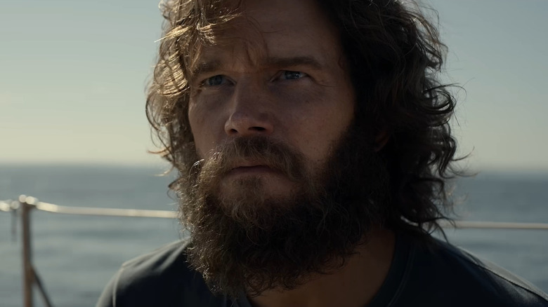 Chris Pratt as James Reece on a boat with long hair and a beard in The Terminal List Season 2