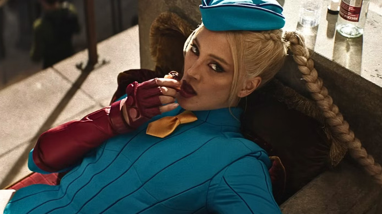 Cammy reclining eating something in Street Fighter