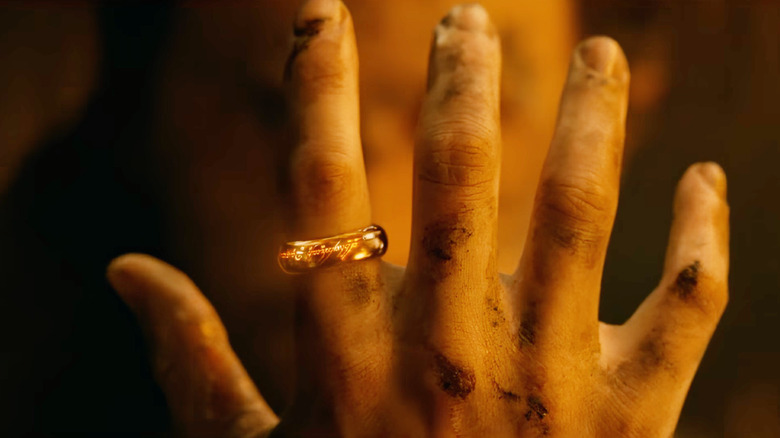 Charlie Vickers as Sauron behold the One Ring on his hand in The Lord of the Rings: The Rings of Power