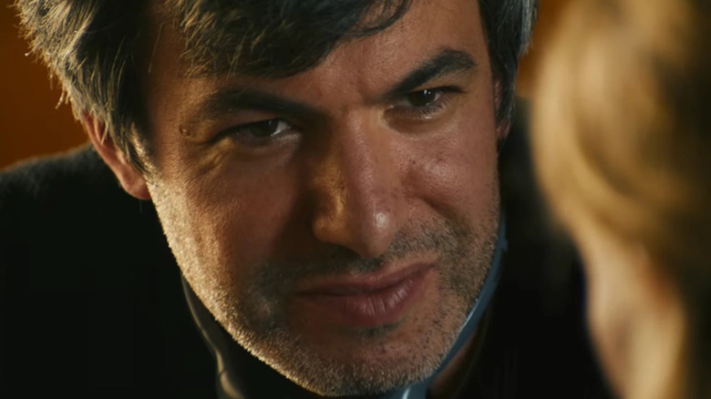 Nathan Fielder squinting at Elizabeth Holmes in You Can See Everything