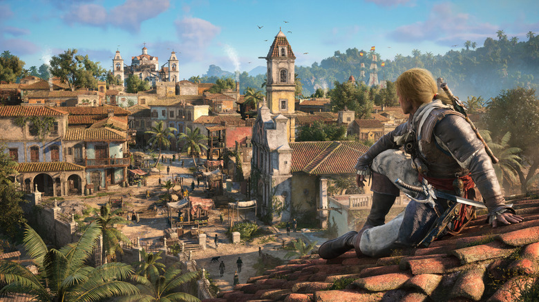 Video game screenshot of a person sitting on a rooftop and looking out at a Caribbean settlement in the 1700s.