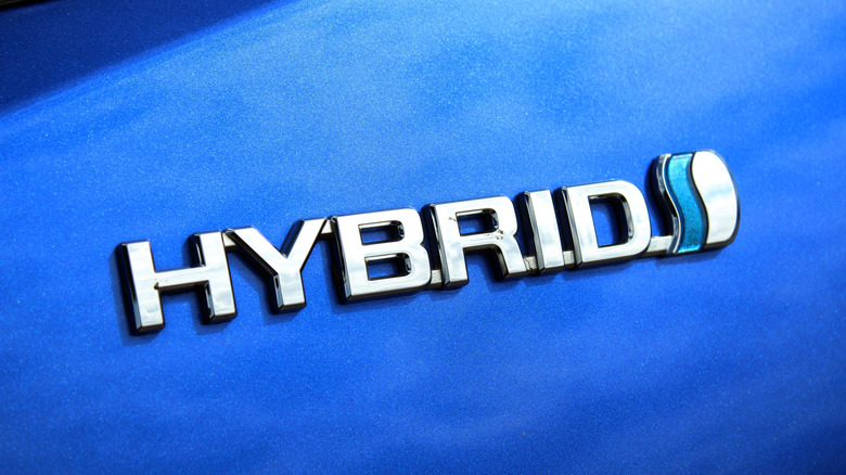 Toyota hybrid badge on a blue car