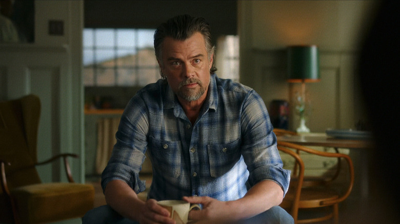 Josh Duhamel's Staten Kirkland sits holding a coffee mug in Ransom Canyon