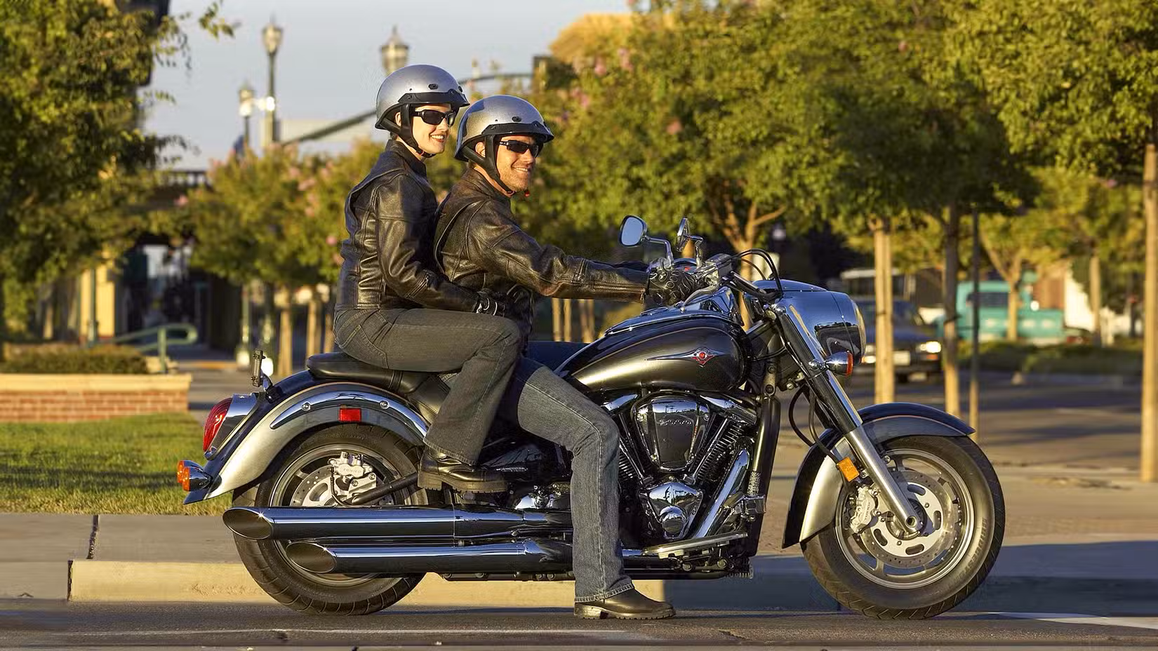 Two Occupants On A Kawasaki Vulcan 2000 Parked On The Street
