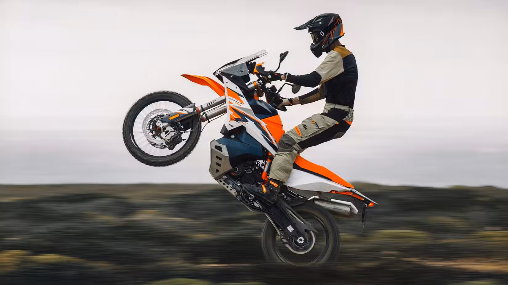 Rider doing a wheelie on the KTM 890 Adventure R