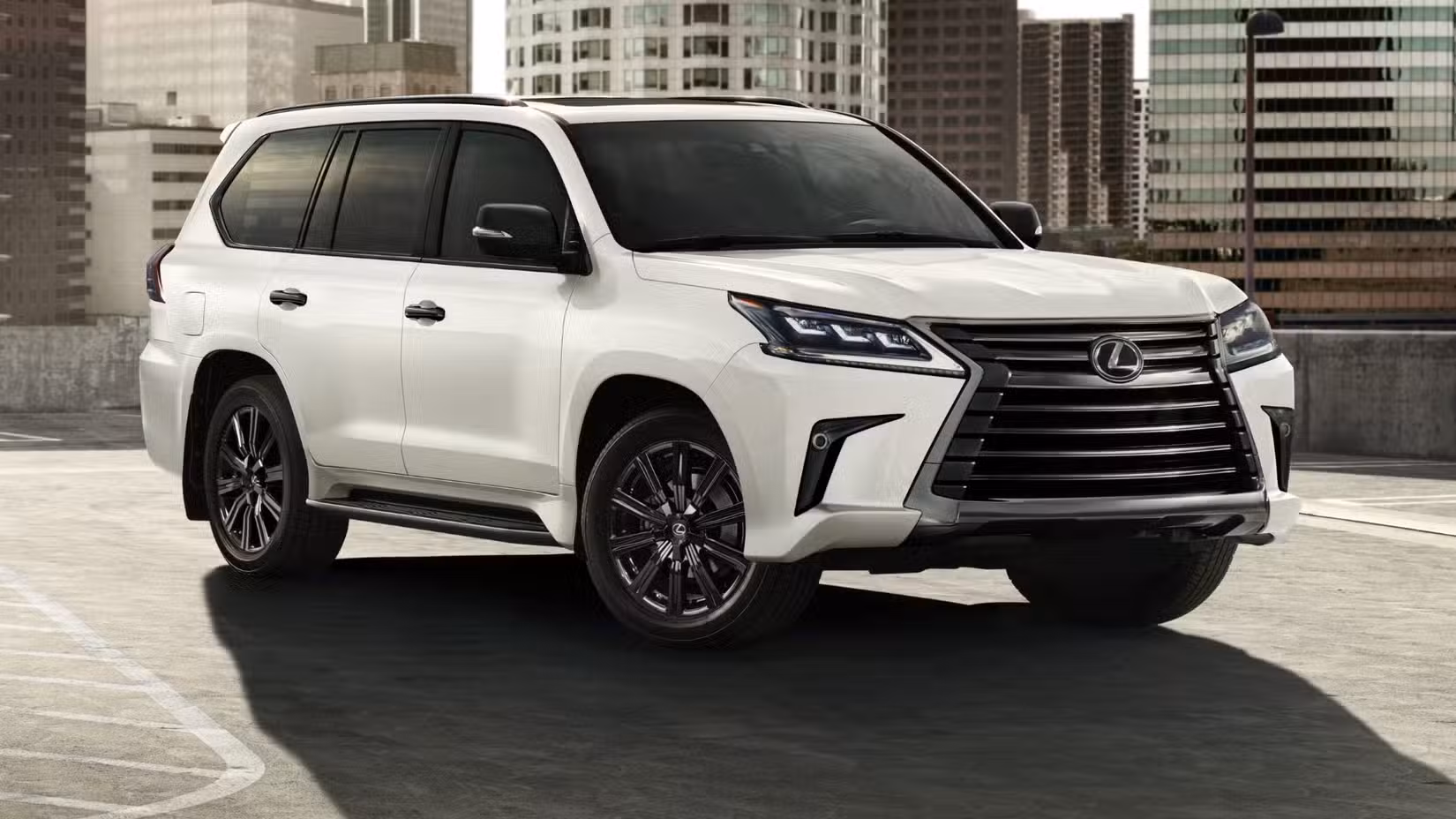 Front 3/4 view of the 2021 Lexus LX 570 parked in a lot