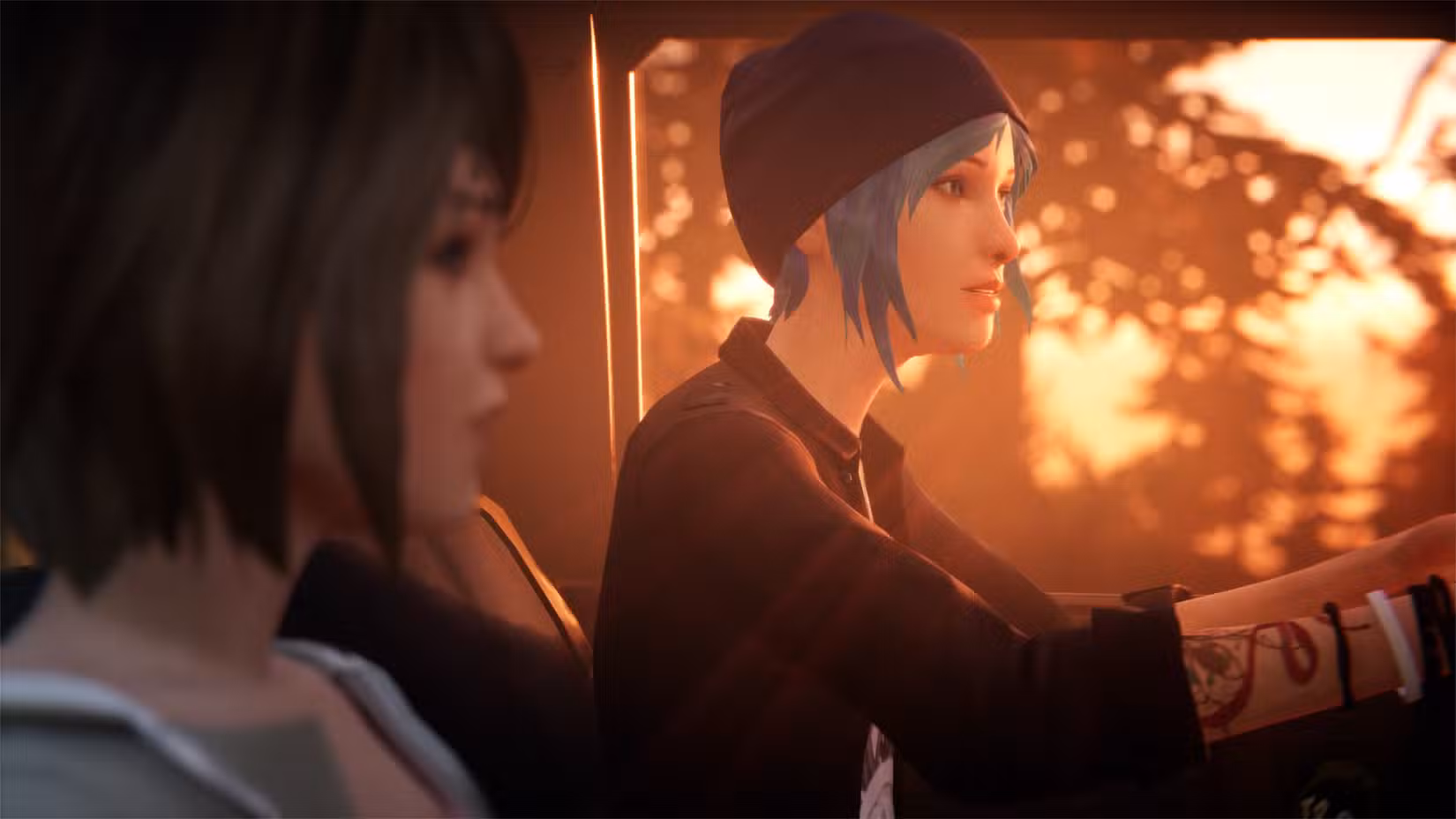 An image from Life is Strange Remastered. It shows Chloe Price and Max Caulfield sitting in Chloe's truck together. Sunlight filters inside the car and over their faces.